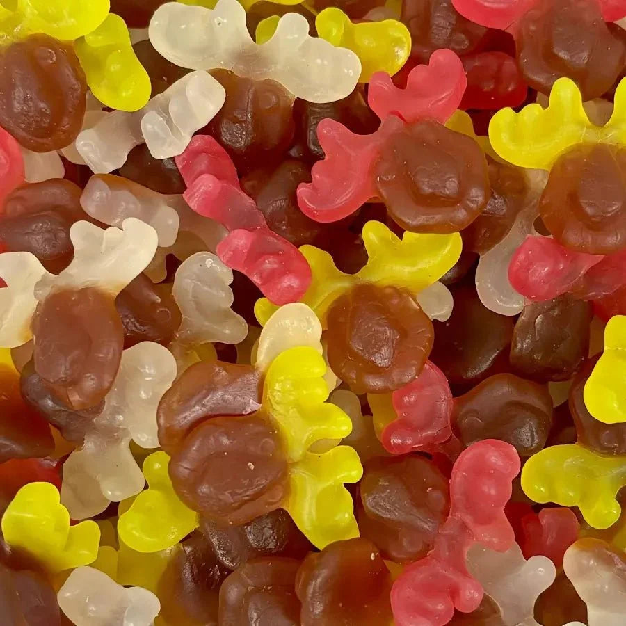 Assorted Gummy Galaxy Jelly Reindeers in festive red and green, shaped like reindeer, on a white background.