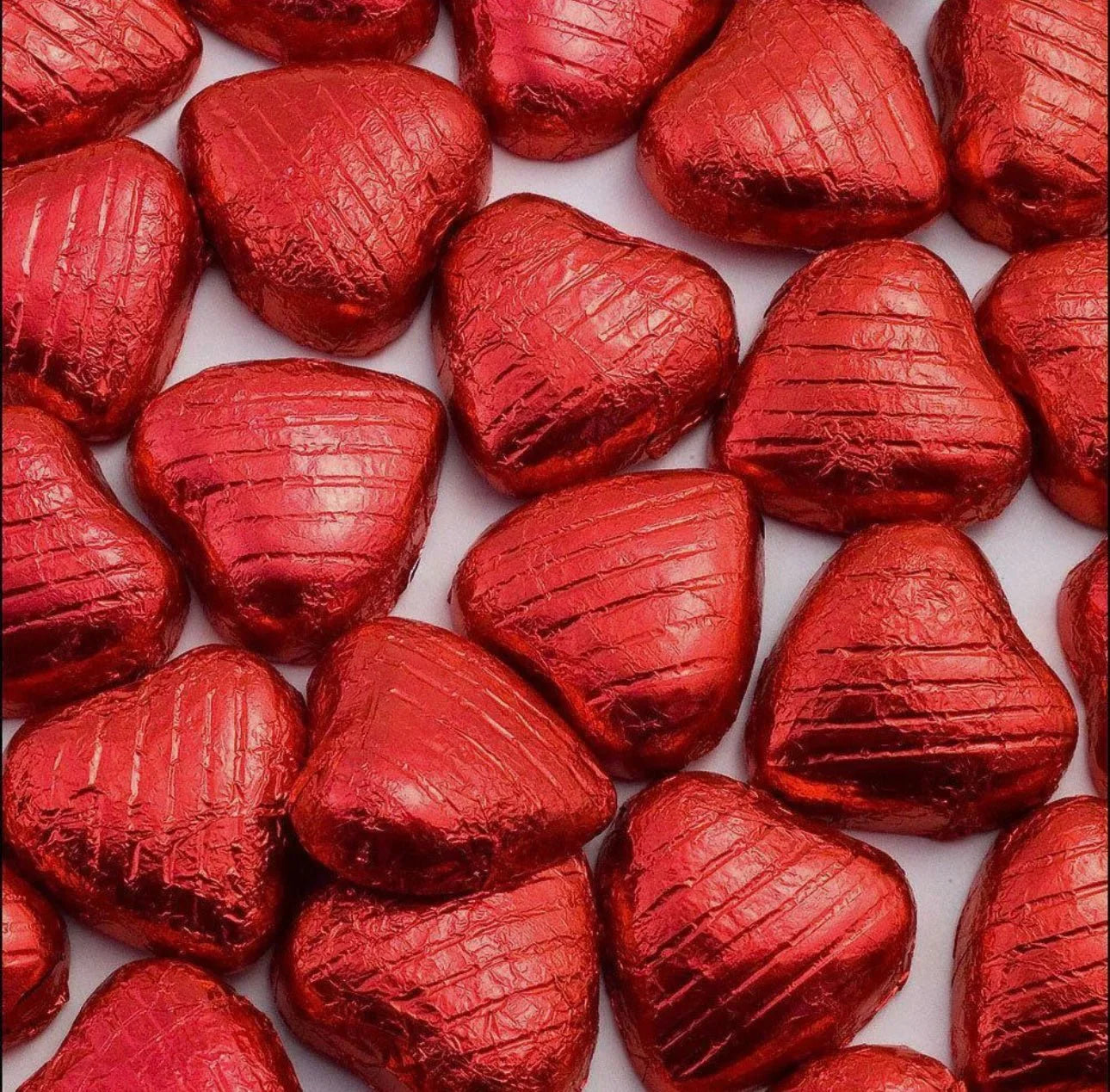 Gummy Galaxy foiled milk chocolate Valentine hearts in shiny gold wrapping, perfect for gifting on Valentine's Day.