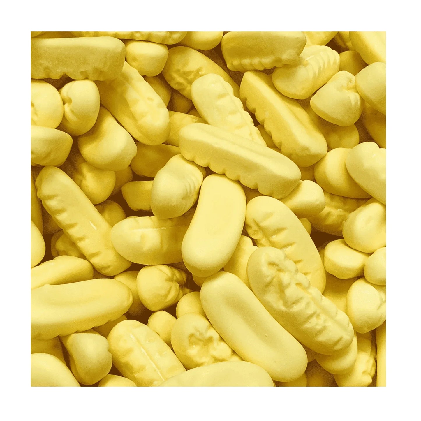 Mini Foam Bananas from Gummy Galaxy, foam sweets shaped like bananas, yellow and textured, 100 grams.